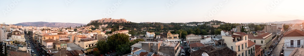 Looking across the Athena Athens cityscape in Greece at the Acropolis at sunset