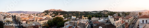Looking across the Athena Athens cityscape in Greece at the Acropolis at sunset © TristanBalme