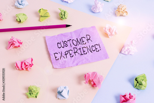 Writing note showing Customer Experience. Business concept for product of interaction between organization and buyer Colored crumpled papers empty reminder blue yellow clothespin