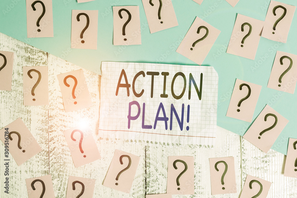 Conceptual hand writing showing Action Plan. Concept meaning proposed strategy or course of actions for certain time Crumbling papers with thick cardboard on the wooden table