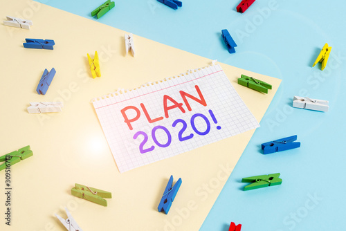 Handwriting text Plan 2020. Conceptual photo detailed proposal doing achieving something next year Colored clothespin paper empty reminder yellow blue floor background office