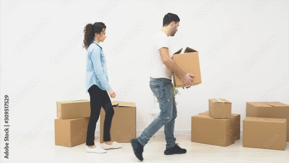 Strong man is carring a large moving box, full of items, isolated on white background. Action. Animation. 4K. Strong man is carring a large moving box, full of items, isolated on white background. Action. Animation. 4K.