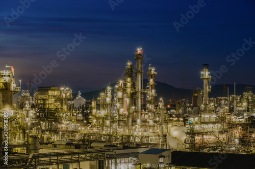 Twilight sky with petrochemical industry estate, glitter lighting of petrochemical industrial on blue sky twilight background © weerapong