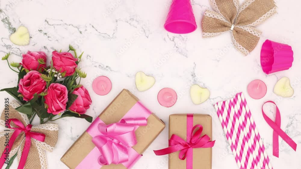 Birthday party decoration, roses, ribbons, candles, gifts, tubes appear on white background - Stop motion Birthday party decoration, roses, ribbons, candles, gifts, tubes appear on white background - Stop motion