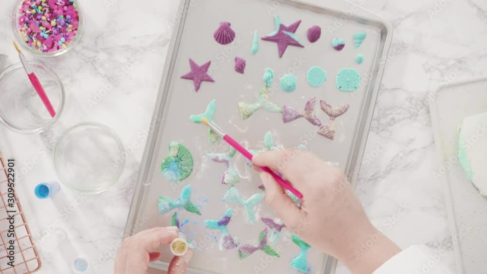 Flat lay. Step by step. Making chocolate mermaid tails in a silicone mold to decorate vanilla cupcakes. Flat lay. Step by step. Making chocolate mermaid tails in a silicone mold to decorate vanilla cupcakes.