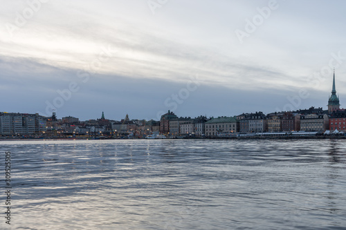 Winter landscapes of Stockholm old city during Christmas, sunset view of Stockholm harbor and big Christmas tree © Sen