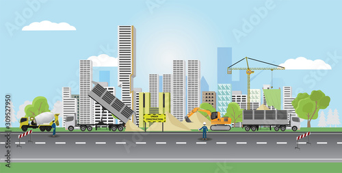Large city that is undergoing renovation and construction. There are signs indicating during construction. Cars for various construction businesses that work.