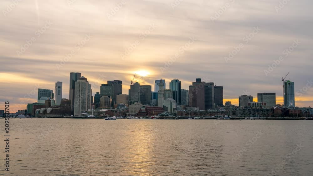 Dusk Time Lapse Of Sun Sunset Behind the Boston Skyline in Winter Dusk Time Lapse Of Sun Sunset Behind the Boston Skyline in Winter