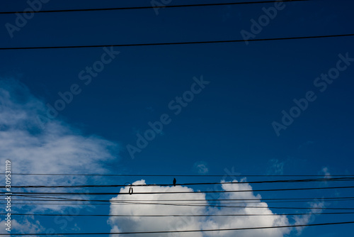 blue sky with clouds reflected in water surface