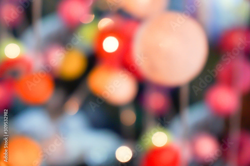 Blurred and bokeh reflection lighting of lights decorating the Christmas tree around beautifully.