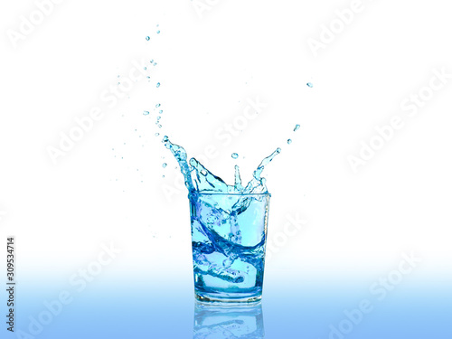 Water splashes in a glass of water isolated on white background