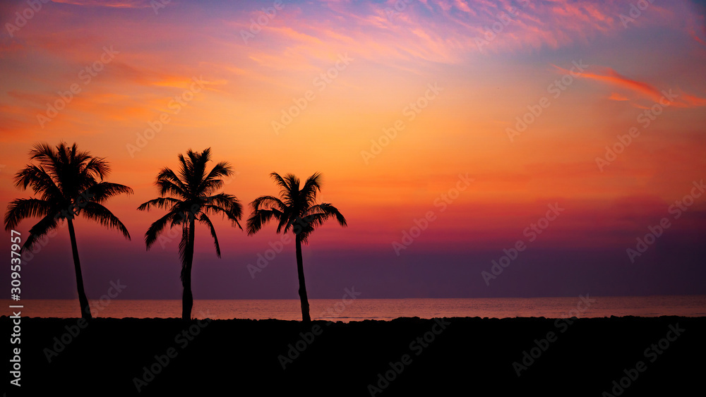 Silhouette Palm Trees By Sea Against Romantic Sky At Sunset