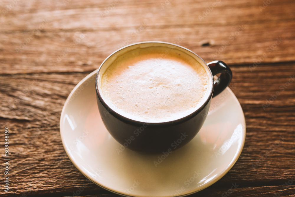 cup of coffee with cream on wooden background cup of coffee with cream on wooden background