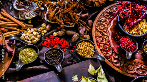 Top view Thai spices and herbs ingredient decoration on wood table for cook in home kitchen. 