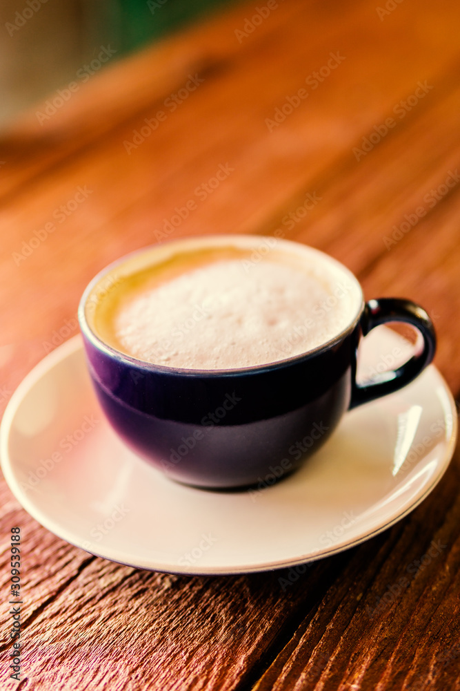 cup of coffee on wooden table cup of coffee on wooden table
