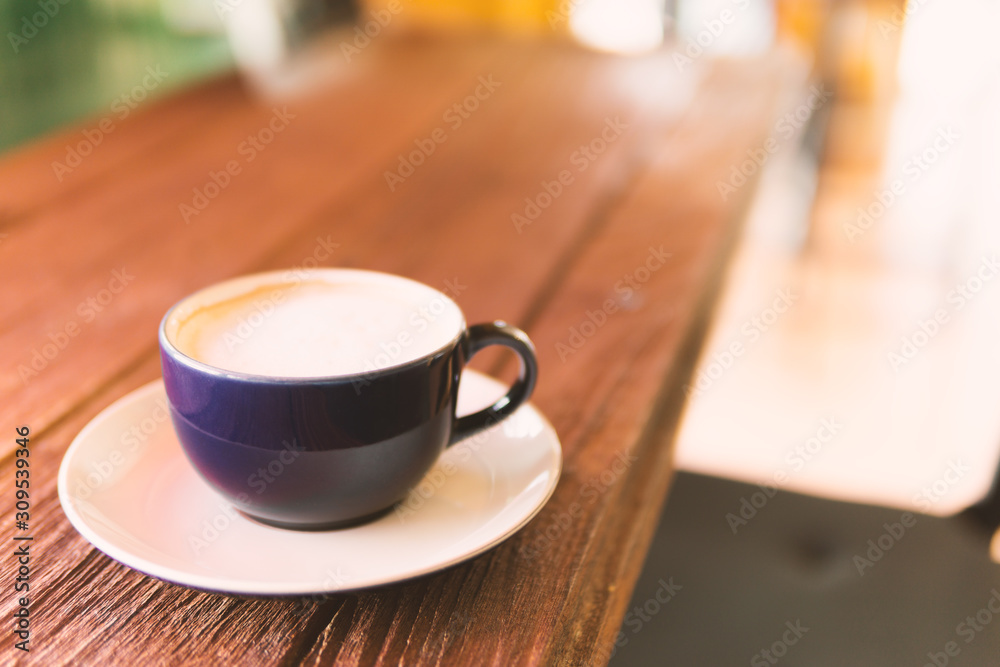 cup of coffee on wooden table cup of coffee on wooden table