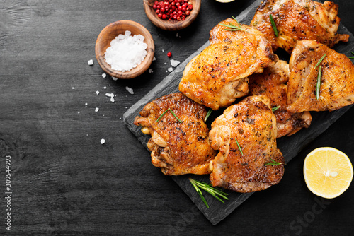 Grilled chicken thighs with spices and lemon. Top view