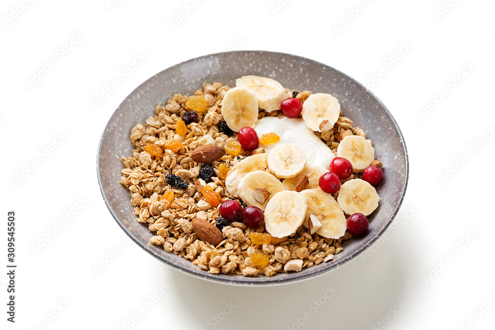 Healthy breakfast. Fresh granola, muesli with yogurt banana and cranberry isolated on white background Healthy breakfast. Fresh granola, muesli with yogurt banana and cranberry isolated on white background