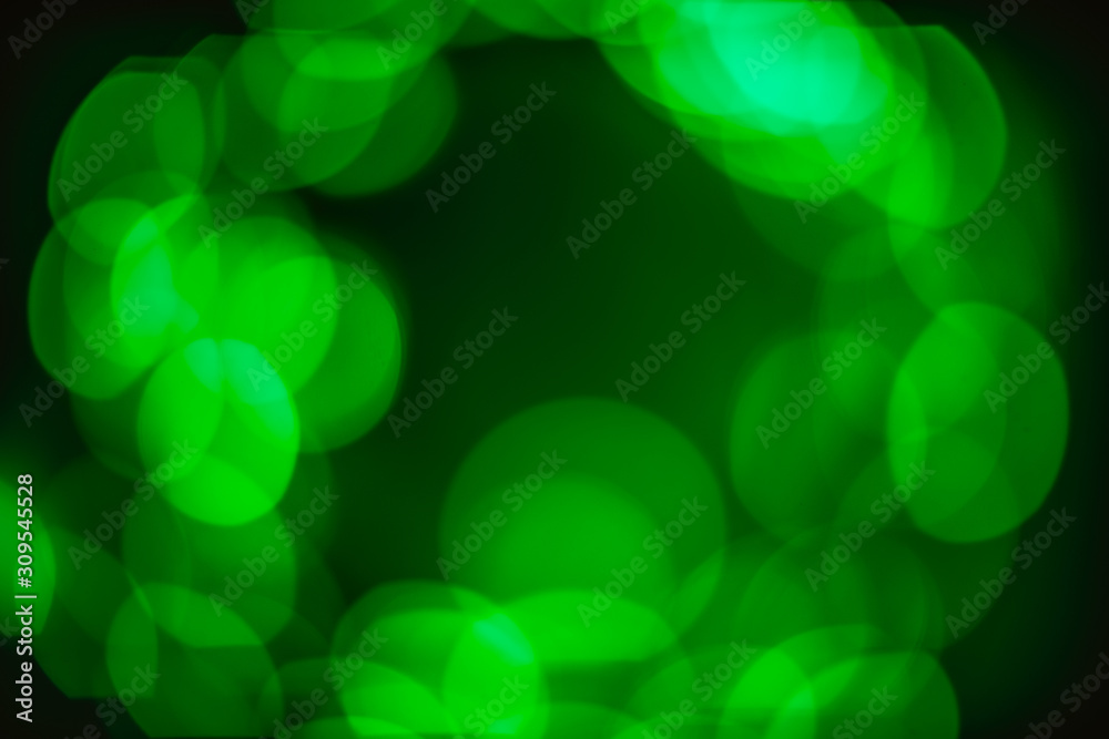 Shiny golden green bokeh in circle on black background. Festive background concept. Christmas, New Year, party Shiny golden green bokeh in circle on black background. Festive background concept. Christmas, New Year, party