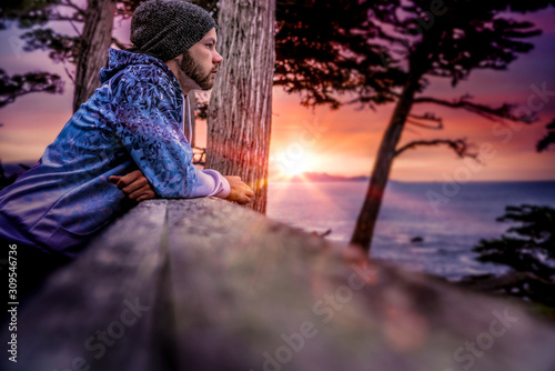 Photography Young man in his twenties deep in thought; sunset in Monterey, California USA