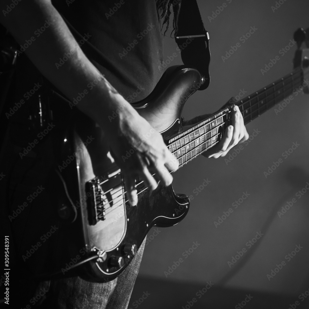 Electric bass guitar player hands, live music theme Stock Photo