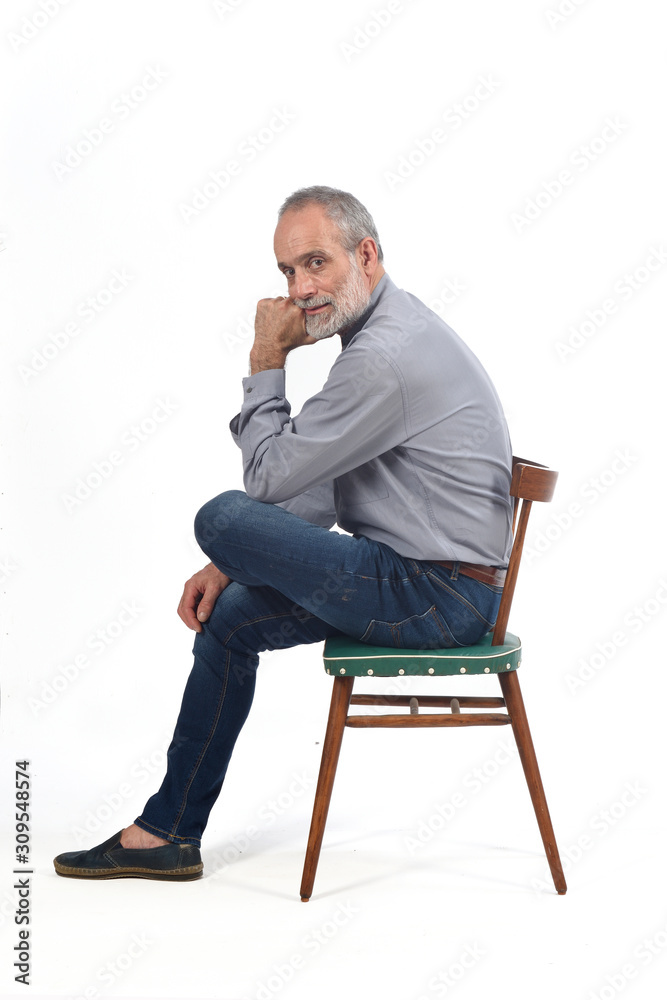 portrait of middle aged man sitting on white portrait of middle aged man sitting on white