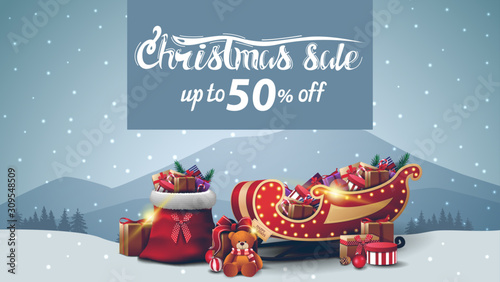 Christmas sale, up to 50% off, discount banner with gray winter landscape, Santa Claus bag, Santa Sleigh with presents and present with Teddy bear