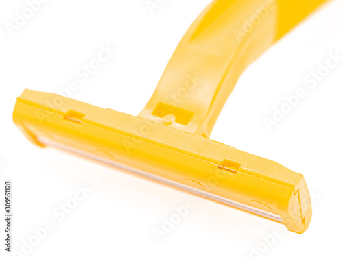 Close up : Yellow razor isolated on white background. Select focus.