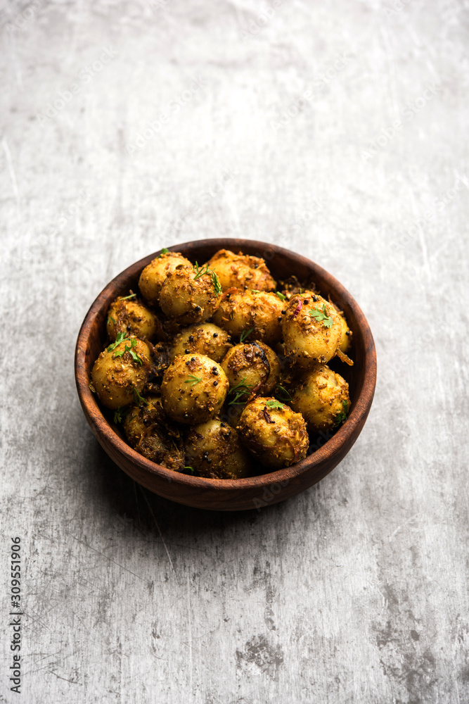 Jeera Aloo - Potatoes Flavoured With Cumin seeds and spices. popular Indian main course recipe. served in a bowl. selective focus Jeera Aloo - Potatoes Flavoured With Cumin seeds and spices. popular Indian main course recipe. served in a bowl. selective focus