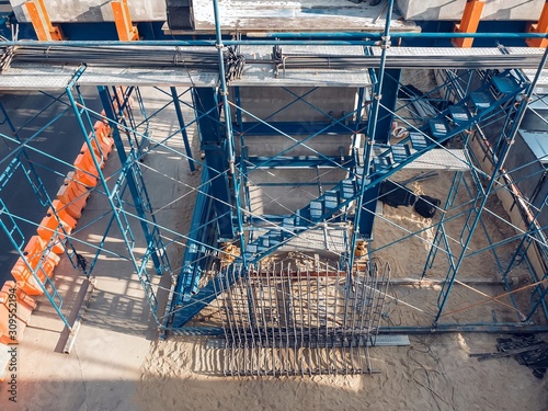The temporary staircase was built for the construction with prevent falling. scaffolding in the construction zone