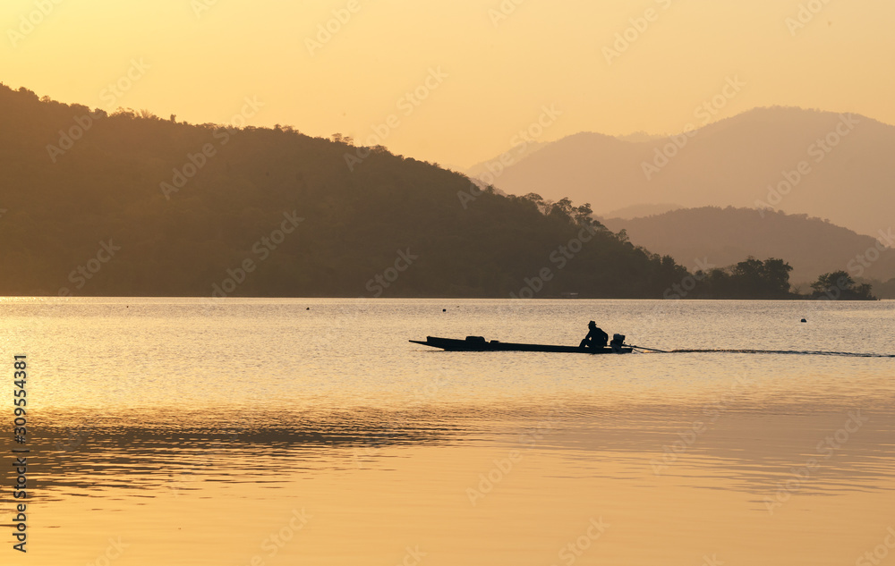 Fototapeta premium sunset or sunrise over river and mountain in Kanchanaburi Province, Thailand.