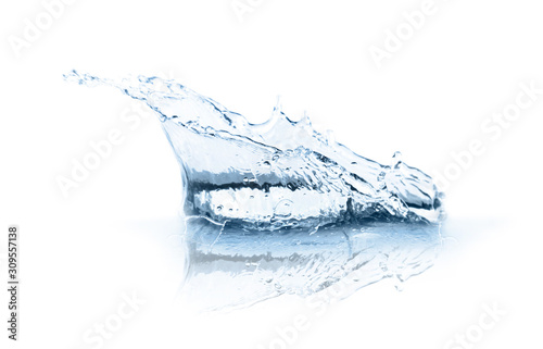 Beautiful clear water splash isolated on white photo