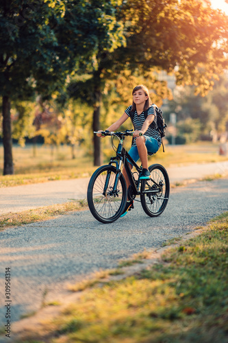 School girl riding bicycle