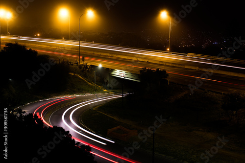 Traffic on a highway seen through lights