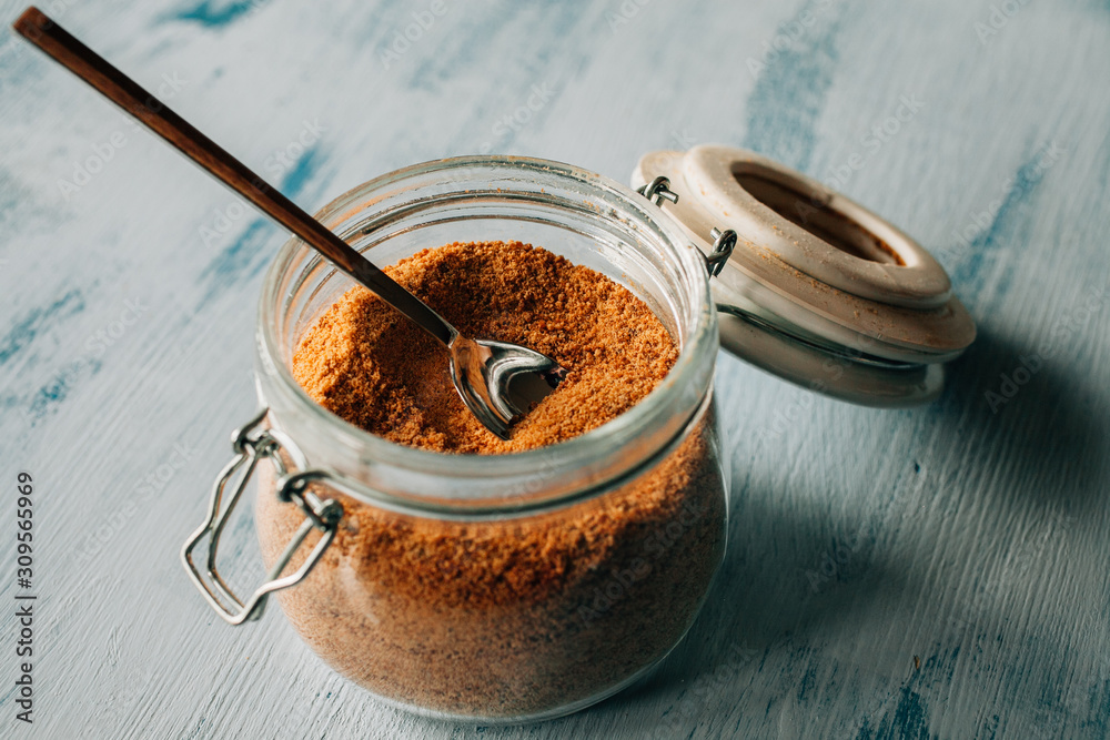 Panela sugar background. Close up view of raw cane sugar in a jar. Panela sugar background. Close up view of raw cane sugar in a jar.