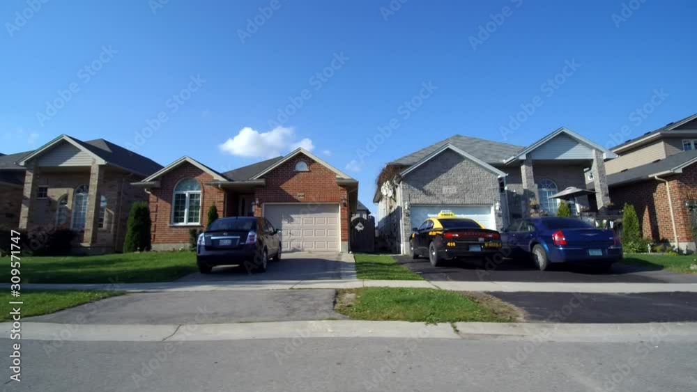 Driving Past Middle Class Neighbourhood Houses Real Estate Side View First Person Driving Past Middle Class Neighbourhood Houses Real Estate Side View First Person