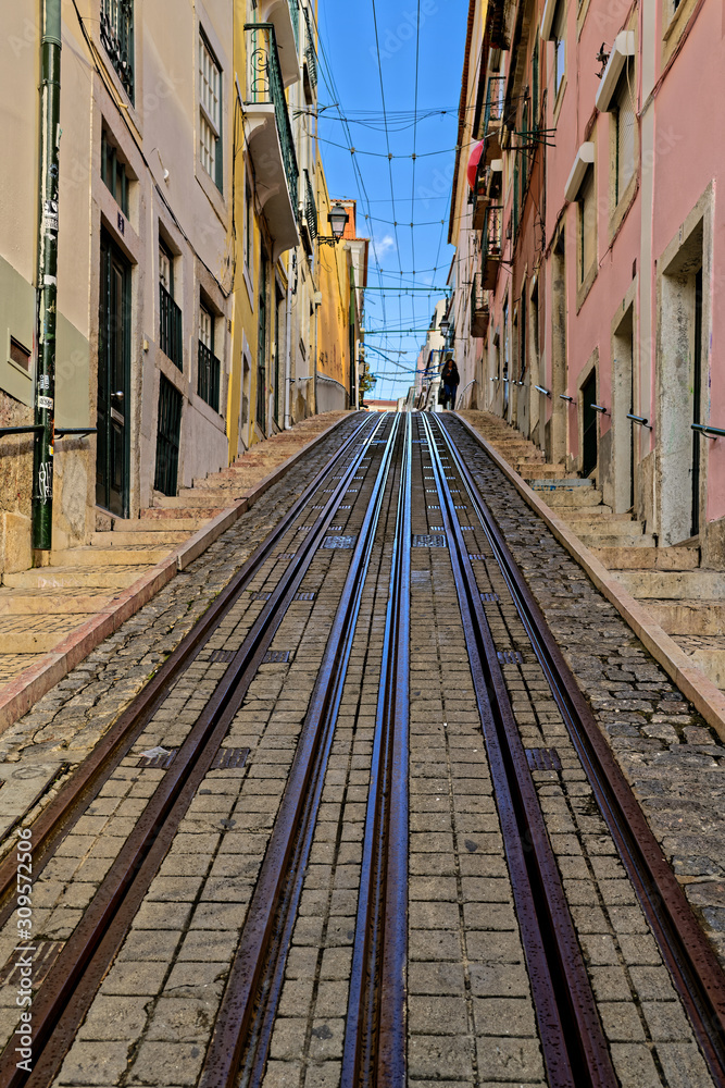 Naklejka premium Narrow street with railway
