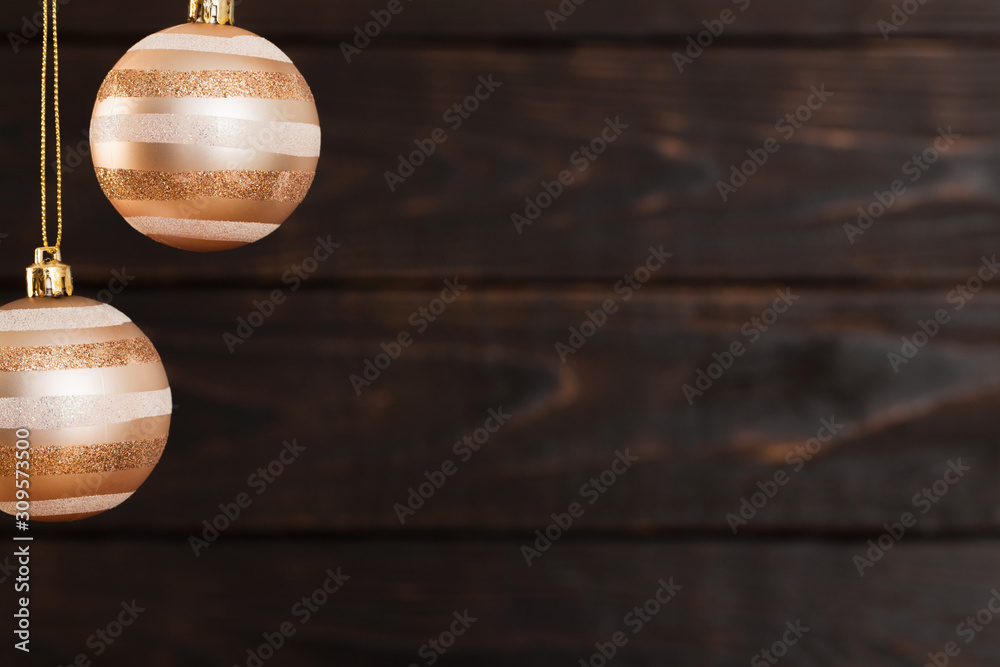 Christmas balls hanging  on  dark  wooden background