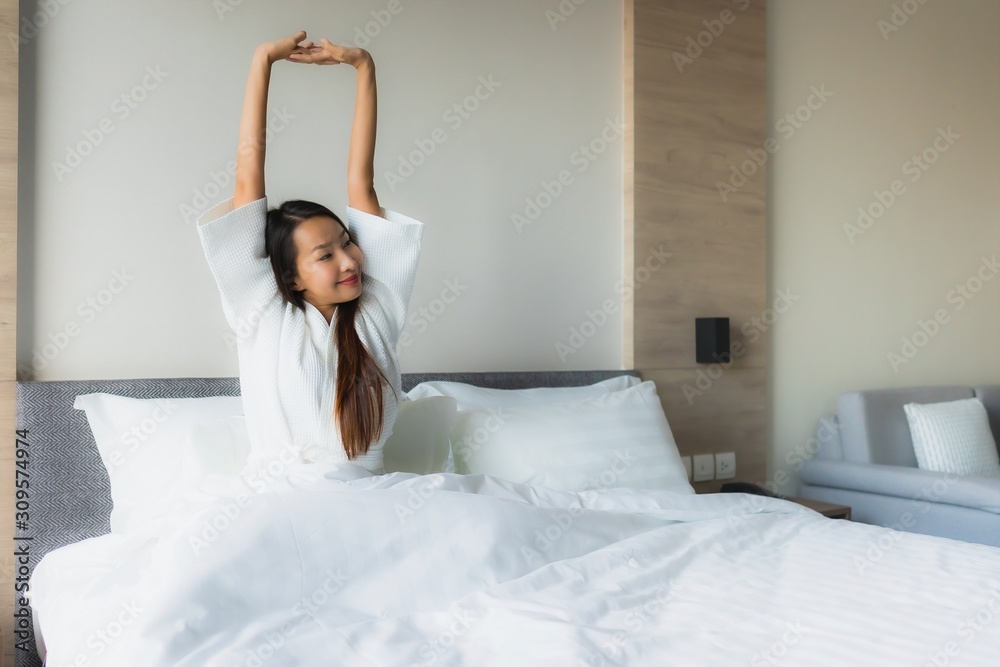Portrait beautiful young asian women happy smile relax on bed Portrait beautiful young asian women happy smile relax on bed