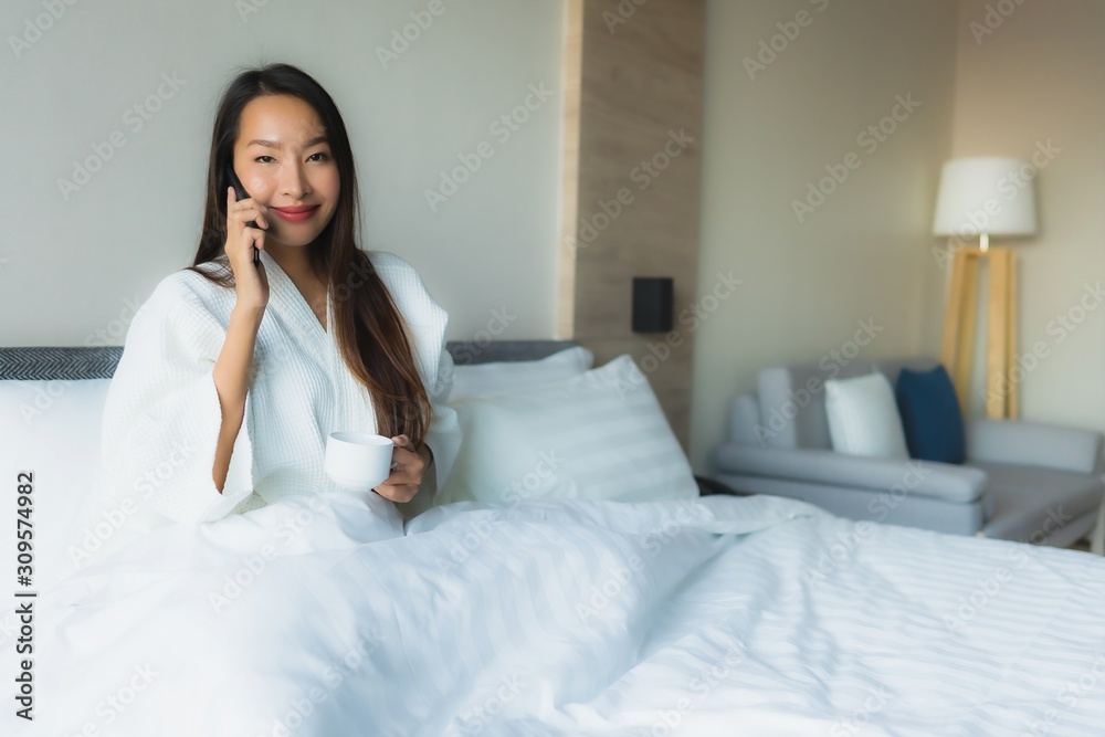 Portrait beautiful young asian women happy smile with coffee and mobile phone Portrait beautiful young asian women happy smile with coffee and mobile phone