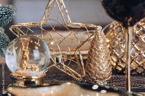 Dining place decorated with toys, glass and plates. New Year eve concept