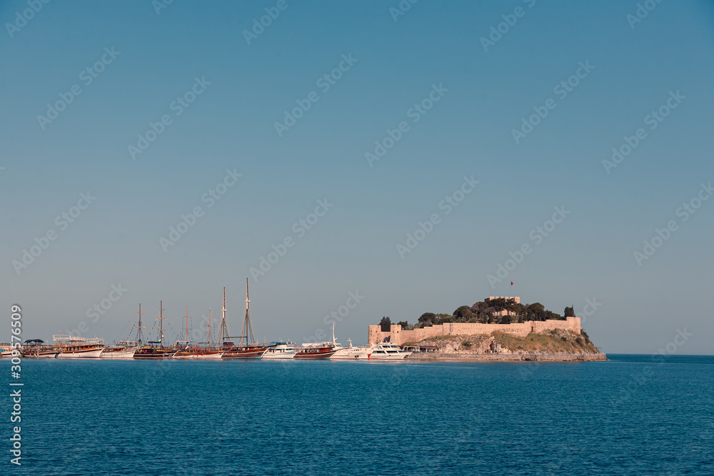 Casual view on the seaside near Kusadasi city port side with buildings in sight, Turkey
