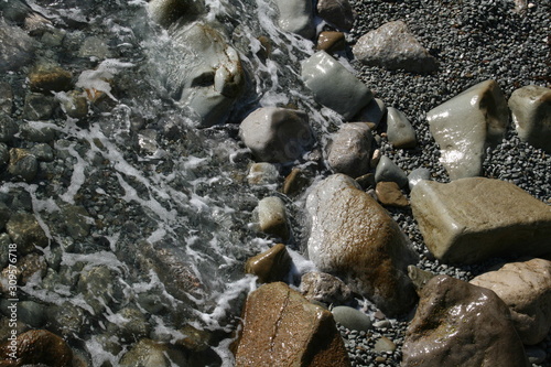 wet stones on the beach of the black sea