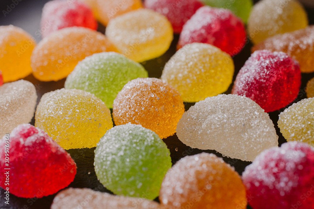 Multicolored fruity jelly candies as texture and background for design. Multicolored fruity jelly candies as texture and background for design.