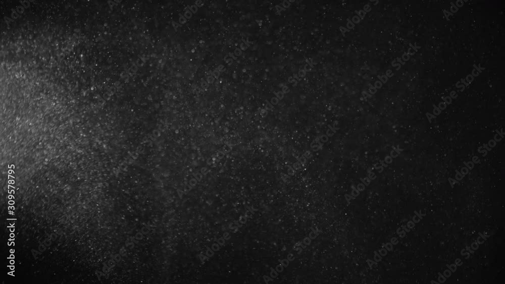Natural Organic Dust Particles Floating On Black Background. Glittering Sparkling Particles Randomly Spin In The Air With Bokeh. Dynamic Particles With Fast And Slow Motion. Shimmering Dust In Space. Natural Organic Dust Particles Floating On Black Background. Glittering Sparkling Particles Randomly Spin In The Air With Bokeh. Dynamic Particles With Fast And Slow Motion. Shimmering Dust In Space.