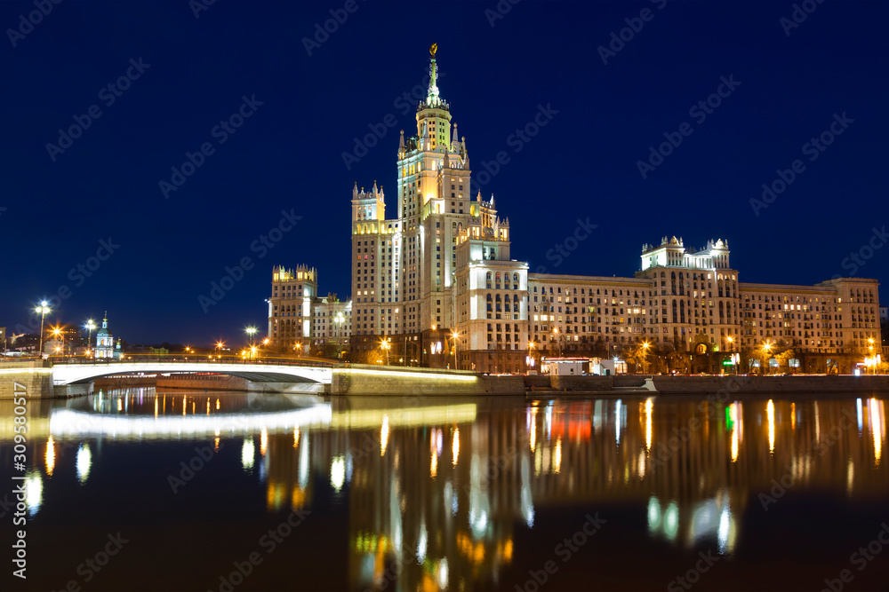 High-rise building on Kotelnicheskaya embankment of the Moscow river late in the evening, Moscow, Russia
