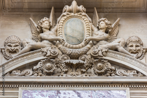 Beautiful  statue at the Paris Opera House, Palais Garnier, in Paris, France is known for its opulent Baroque style interior decor and Beaux-Arts exterior architecture.
