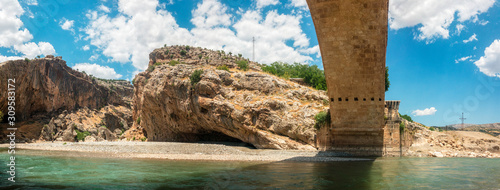 Panoramic view of the Severan Bridge, Cendere Koprusu is a late Roman bridge, close to Nemrut Dagi and Adiyaman, Turkey. Roadway flanked by ancient columns of Roman Emperor Lucius Septimius Severus photo