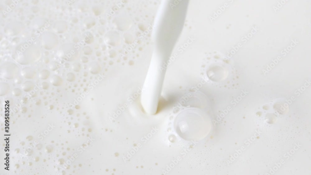 Pouring fresh milk in slow motion, moving water on white background, Closeup Front view Food concept. Pouring fresh milk in slow motion, moving water on white background, Closeup Front view Food concept.