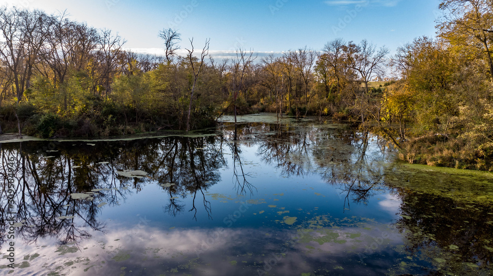 Morning over a rural countryside pond in Nebraska during autumn